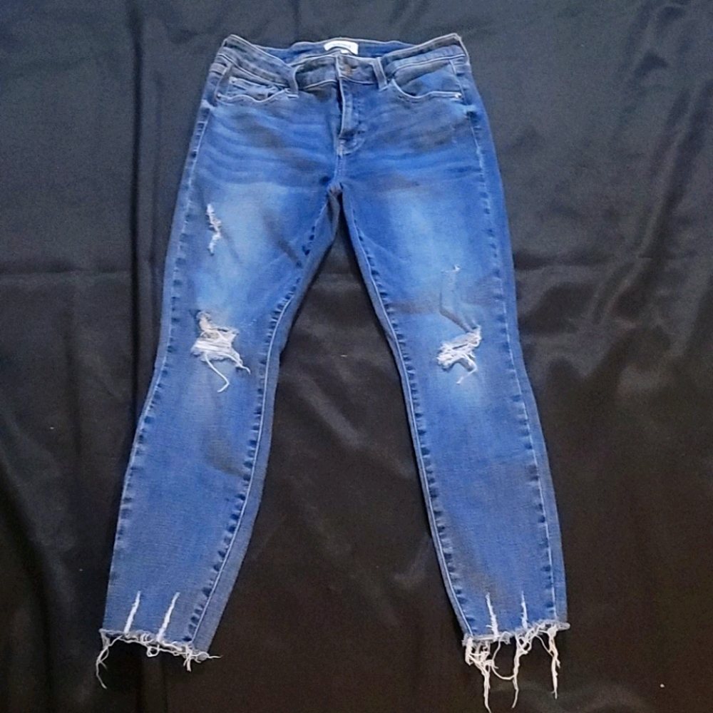 Distressed blue jeans